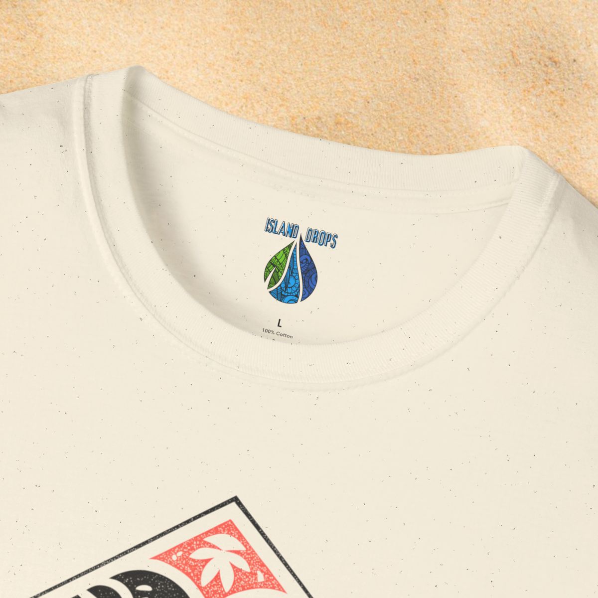 Close-up of a beige t-shirt with 'Island Drops' label t-shirt with 'ISLANDER' tribal graphic design - Island Drops T-shirt collection | Unisex t-shirt