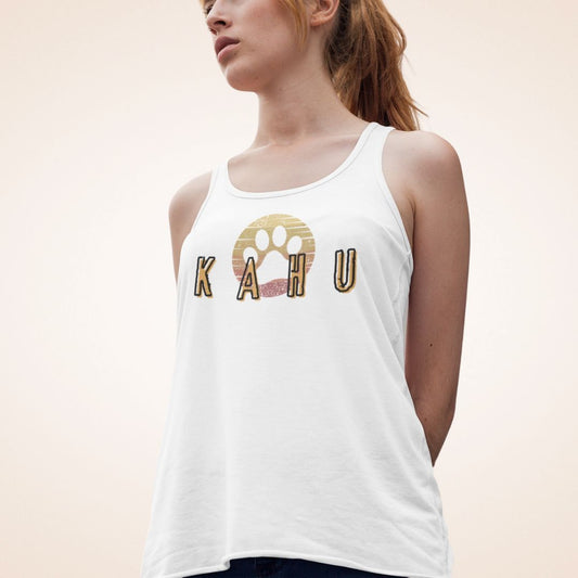 Person wearing white tank top with 'Kahu'  graphic design- Island Drops tank tops collection | Women's racer back tank
