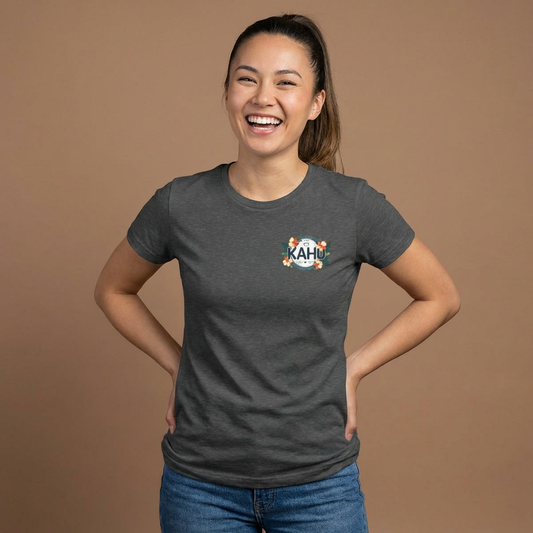 Woman wearing a dark gray women's t-shirt with a graphic KAHU design with flowers and paw prints  - Island Drops women's t-shirt collection | Women's cut t-shirt