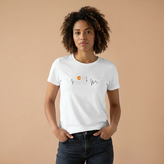 Person wearing a white women's cut t-shirt with sunset heartbeat graphic design - Island Drops Women's collection | Women's cut t-shirt