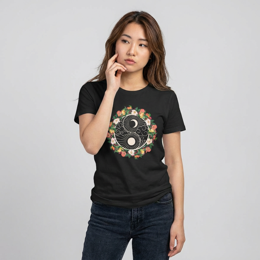 Person wearing a black women's cut t-shirt with floral yin yang graphic design - Island Drops Women's collection | Women's cut t-shirt