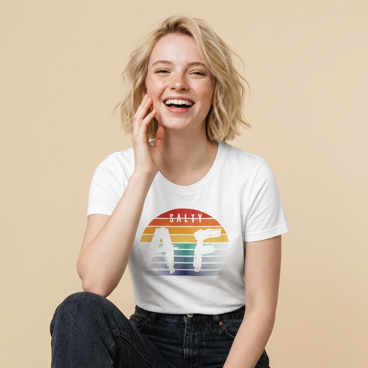 Woman wearing a white women's cut t-shirt with a colorful rainbow sunset graphic and 'Salty AF' text - Island Drops Women's collection | Women's cut t-shirt