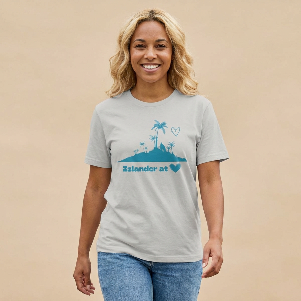 Person wearing a gray t-shirt  with 'Islander at Heart' text with palm trees and island graphic design - Island Drops t-shirt collection | Unisex t-shirts