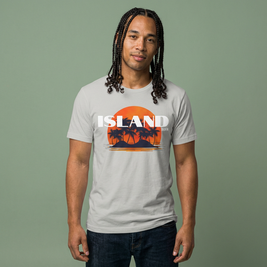 Man wearing a t-shirt with 'ISLAND BORN' graphic design with sunset and palm trees on an island - Island Drops t-shirt collection | Unisex t-shirts