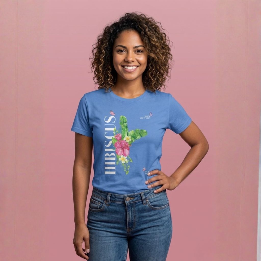 Person wearing a blue t-shirt with 'HIBISCUS' text and a a stylized hibiscus graphic design - Island Drops t-shirt collection | Unisex t-shirt