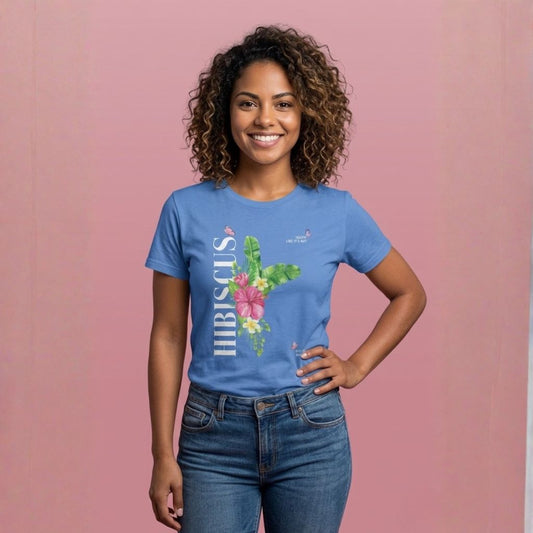 Person wearing a blue t-shirt with 'HIBISCUS' text and a a stylized hibiscus graphic design - Island Drops t-shirt collection | Unisex t-shirt