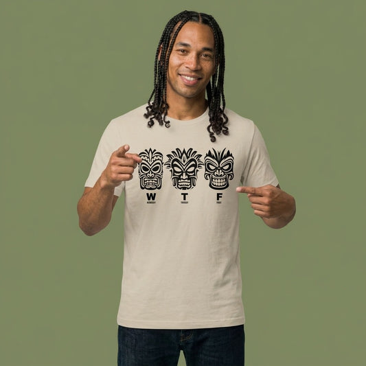 Man pointing to a beige t-shirt with three tiki mask designs and 'WTF' text t-shirt - Island Drops t-shirt collection | Unisex t-shirts