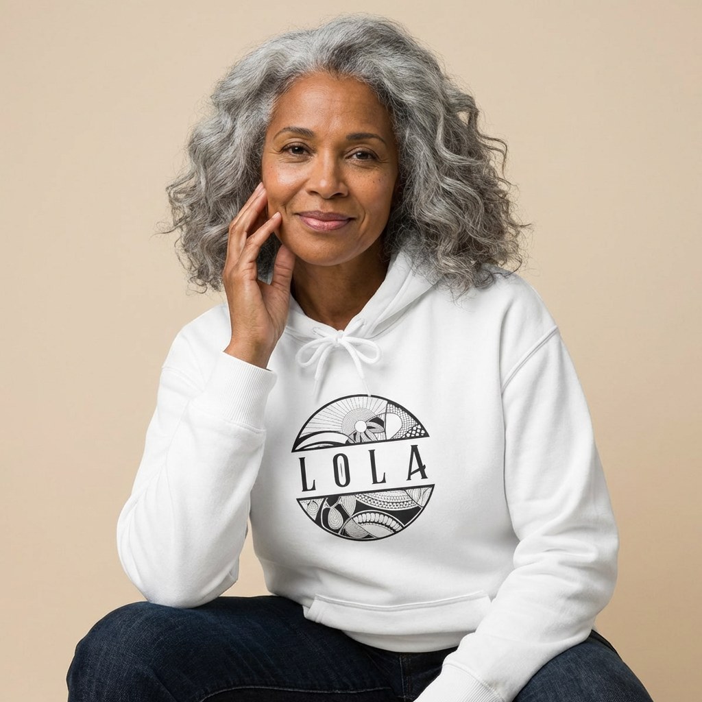 Woman wearing a white hoodie with 'LOLA', meaning grandma, graphic design - Island Drops hoodie collection | Unisex pullover